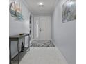 Inviting foyer with neutral walls, marble floors, and decorative nautical accents at 734 Canberra Rd, Winter Haven, FL 33884