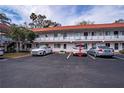 Charming two-story condo building with well-maintained landscaping and convenient parking at 1100 Martinique Dr # 106, Winter Haven, FL 33884