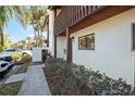 Charming condo exterior featuring a quaint entrance, garden area and well-maintained grounds at 1103 Country Club Dr # A-3, Lake Wales, FL 33898
