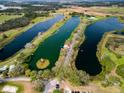 Expansive aerial shot highlighting the community's interconnected lakes, perfect for watersports at 20143 Sunset Landing Ave, Groveland, FL 34736