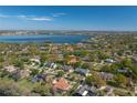Beautiful aerial view of the house in a lakeside community with mature trees and lush landscaping at 2506 Partridge Dr, Winter Haven, FL 33884
