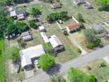Aerial view of a property with multiple outbuildings and ample space, showcasing its potential at 2606 Tall Palm Ave, Lake Wales, FL 33898