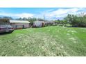 Spacious backyard offering ample room for outdoor activities and potential landscaping projects at 2606 Tall Palm Ave, Lake Wales, FL 33898