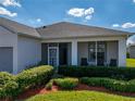 Inviting screened-in front porch with comfortable seating, perfect for relaxing and enjoying the neighborhood views at 3686 Plymouth Dr, Winter Haven, FL 33884