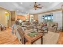 Spacious living room featuring hardwood floors, tray ceilings, and ample natural light at 4073 Sable Loop Dr, Lake Wales, FL 33859