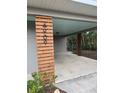 Close-up of stylish wood carport support with modern house number detail; features updated design at 4909 Fleetwood St, Lake Wales, FL 33859