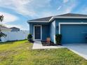Beautiful exterior of a well-kept home with lush green lawn and manicured shrubbery at 663 Lucerne Blvd, Winter Haven, FL 33881