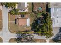 Aerial view of a property highlighting the house, its surroundings, and a bordering yellow boundary line at 750 Avenue O Sw, Winter Haven, FL 33880
