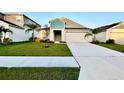 Inviting single-Gathering home with a well-kept lawn, landscaping, and a spacious driveway at 1397 Axel Cir, Winter Haven, FL 33880