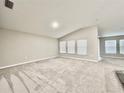 Bright, open living space with neutral walls, plush carpeting, and multiple windows for natural light at 1397 Axel Cir, Winter Haven, FL 33880