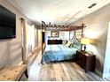 Spacious main bedroom with a decorative bed frame and modern decor at 1442 Gilmore Ave, Lakeland, FL 33805