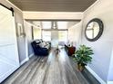 Comfortable sitting room with stylish decor and wood laminate flooring at 1442 Gilmore Ave, Lakeland, FL 33805