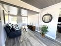 Bright sitting room featuring a comfortable couch and stylish decor at 1442 Gilmore Ave, Lakeland, FL 33805