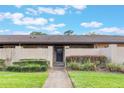 Charming condo featuring a private courtyard with lush landscaping and a secure gated entrance at 2254 Firestone Pl # 2254, Winter Haven, FL 33884