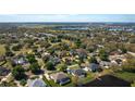 Beautiful community aerial view with lakes and mature trees surrounding single Gathering homes at 315 Bayberry Dr, Polk City, FL 33868