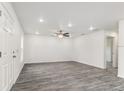 Spacious living room boasts modern flooring, recessed lighting, and an open floor plan at 3438 Avenue E Nw, Winter Haven, FL 33880