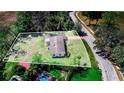 Aerial view of the property showcasing the generous lot size with mature tree coverage at 352 W Graham Park Dr, Haines City, FL 33844