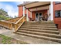 View of the steps and wheelchair ramp leading to the second-story porch of the house at 3655 N Scenic Hwy, Lake Wales, FL 33898