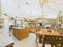 Open concept kitchen with a center island and adjacent dining area, perfect for entertaining at 3690 Wellington Pl, Bartow, FL 33830