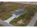 Birds-eye view of a single Gathering home with a wide driveway and well-maintained landscaping at 42 Mountain Dr, Babson Park, FL 33827