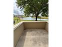 Cozy patio overlooking a tranquil lake view, perfect for relaxing outdoors at 703 Eagle Pond Dr # 703, Winter Haven, FL 33884