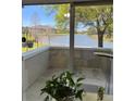 Enjoy this condo's lovely water view, which features bright natural light and a glimpse of neighborhood homes at 703 Eagle Pond Dr # 703, Winter Haven, FL 33884