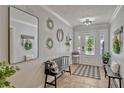 Welcoming entryway with decorative accents, a stylish bench, and a well-lit, inviting atmosphere at 2350 Crump Rd, Winter Haven, FL 33881