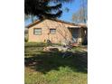 View of the side of the house with a back door and patio space at 334 Main St, Haines City, FL 33844