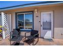 Welcoming front entrance with outdoor seating, providing a charming space to relax and enjoy the surroundings at 398 Winter Ridge Blvd # 398, Winter Haven, FL 33881