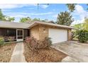 Beautiful brick home featuring an attached garage and well-maintained landscaping at 4615 Reynosa Sw Dr, Winter Haven, FL 33880