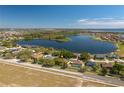 Scenic aerial view of the home's location near a lake, offering a sense of community and natural beauty at 633 Hart Lake Dr, Winter Haven, FL 33884