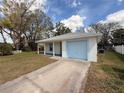 View of a single-story home showcasing a one-car garage, driveway, and well-maintained lawn at 847 Kristen Ct, Bartow, FL 33830