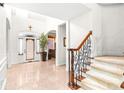 Spacious foyer with tile flooring and elegant staircase at 926 S Lakeshore Blvd, Lake Wales, FL 33853