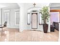 Sunlit foyer with tiled floors and a decorative potted plant at 926 S Lakeshore Blvd, Lake Wales, FL 33853