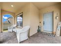 Inviting front porch with brick floors, ample seating, and a cheerful blue front door at 10234 Lenox St, Clermont, FL 34711