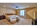 This spacious main bedroom features a seating area and plenty of natural light at 1091 Sugarwood St, Davenport, FL 33837