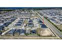 Wide aerial shot of a residential neighborhood, showcasing a community layout with numerous homes at 1108 Zion Dr, Haines City, FL 33844