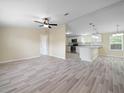 Open-concept living space with modern flooring and neutral wall colors at 1302 Windsong Dr, Lakeland, FL 33811