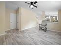 Comfortable living area featuring stylish flooring and chair at 1302 Windsong Dr, Lakeland, FL 33811