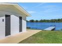 View of lake from building with restroom and picnic area with dock at 1550 11Th Ne St # G6, Winter Haven, FL 33881