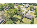 Overhead shot capturing the home's setting amidst lush greenery and neighborhood surroundings at 210 Pinehurst Dr, Auburndale, FL 33823