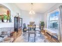 Cozy dining area with ample natural light, modern furnishings, and stylish decor at 238 Lake Eloise Pointe Blvd, Winter Haven, FL 33880