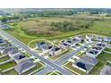 Aerial view of a residential neighborhood showcasing the layout and surrounding landscape at 271 Inman Blvd, Winter Haven, FL 33881