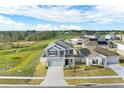 Beautiful home in a residential neighborhood with a spacious backyard and green common area at 271 Inman Blvd, Winter Haven, FL 33881