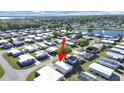 Aerial view of the property within a vibrant community with lakes and lush greenery at 4986 Foxwood Lake Dr, Lakeland, FL 33810