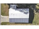 Overhead view of roof, driveway, and surrounding landscape at 4986 Foxwood Lake Dr, Lakeland, FL 33810