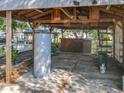 Outdoor covered pool area with storage and a water heater near the pool, great for relaxation at 5402 Parkway Drive, Belle Isle, FL 32809