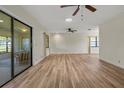 Spacious living room with new flooring, ceiling fan, and lots of natural light at 602 Turnberry Ct, Winter Haven, FL 33884