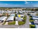 Aerial view of a well-maintained manufactured home in a beautiful community near the water at 6433 Jacaranda Ne Ave, Winter Haven, FL 33881