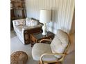 Cozy living room showcasing bamboo furniture, a sofa and unique wicker accents at 6515 Raintree Ne Ln, Winter Haven, FL 33881